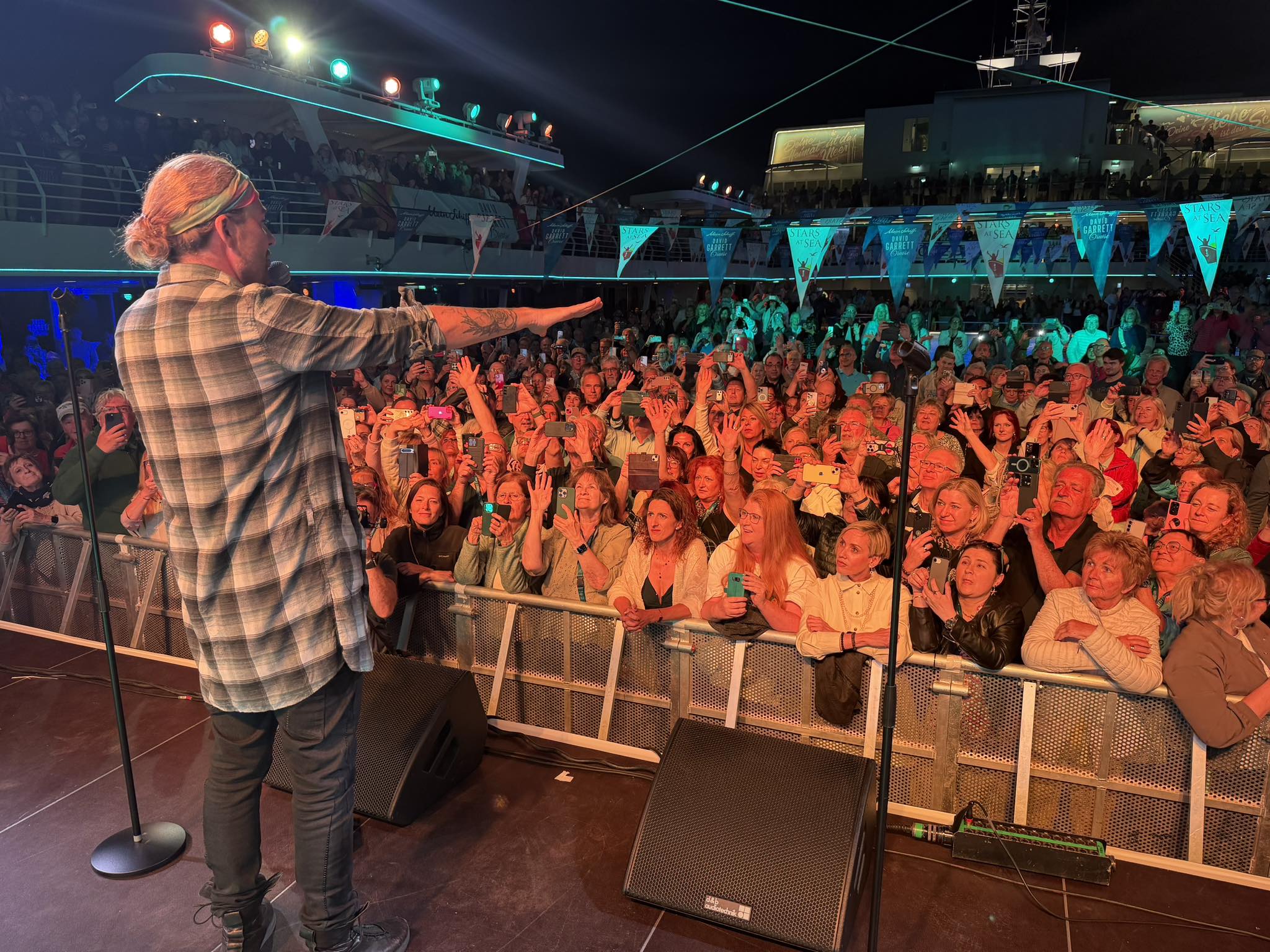 David Garrett facing the cheering crowd from the stage, David Garrett Cruise, April 2026